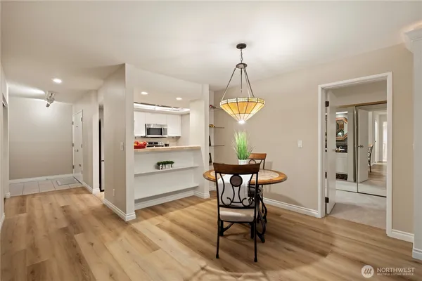 a view of a dining room with furniture window and wooden floor