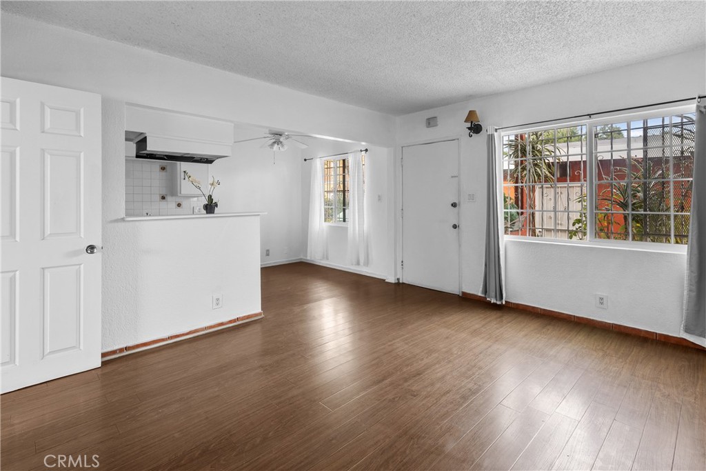 330 West Laurel Street, Unit A Compton, CA 90220 - Photo 3 of 10 a view of a kitchen with wooden floor and a window