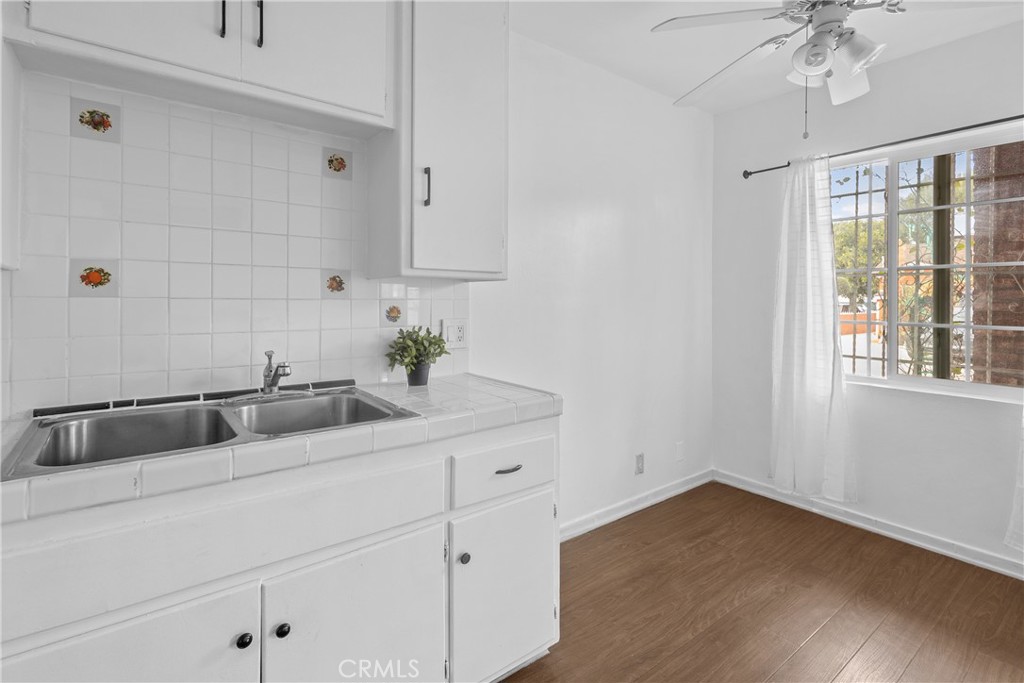 330 West Laurel Street, Unit A Compton, CA 90220 - Photo 4 of 10 a kitchen with a sink and cabinets