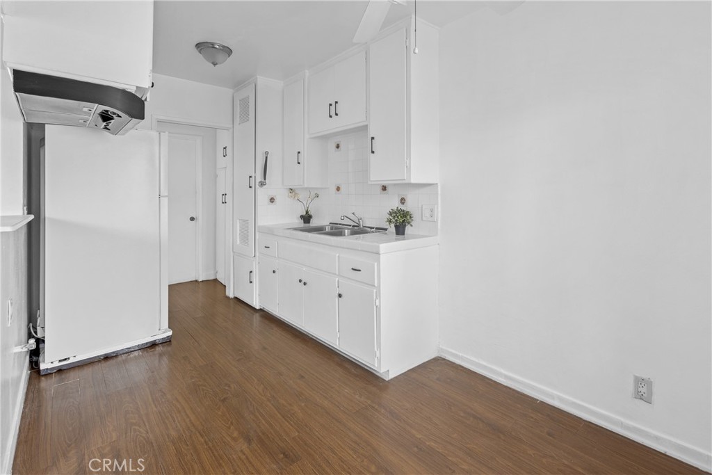 330 West Laurel Street, Unit A Compton, CA 90220 - Photo 5 of 10 a view of kitchen with wooden floor