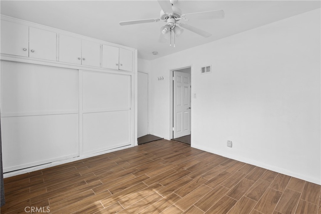 330 West Laurel Street, Unit A Compton, CA 90220 - Photo 9 of 10 a view of an empty room with wooden floor
