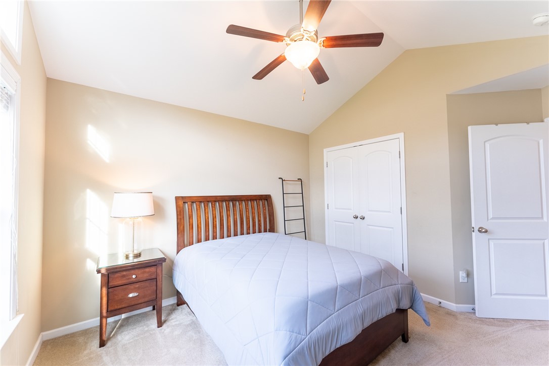 1012 Whirlaway Circle Anderson, SC 29621 - Photo 18 of 25 A comfortable bedroom features a vaulted ceiling, soft carpeting, and a dual-door closet.