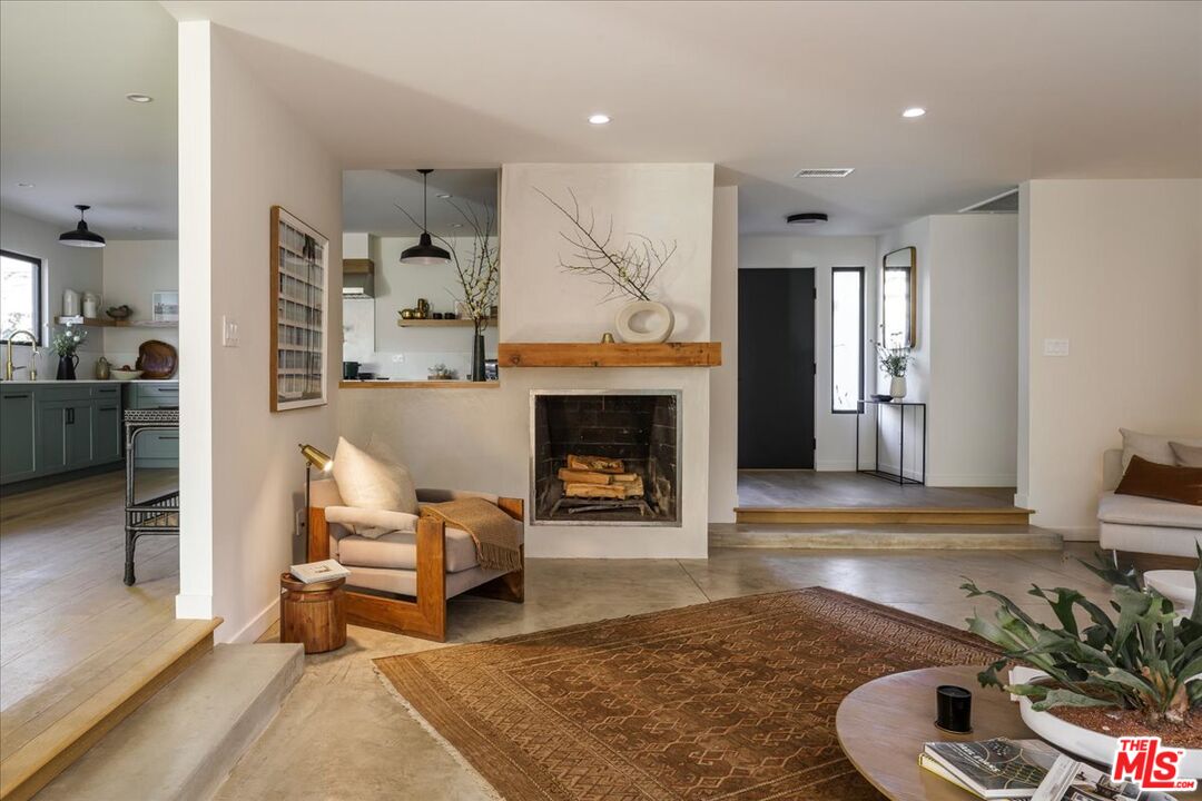 4119 Aralia Road Altadena, CA 91001 - Photo 15 of 37 a living room with furniture and a fireplace