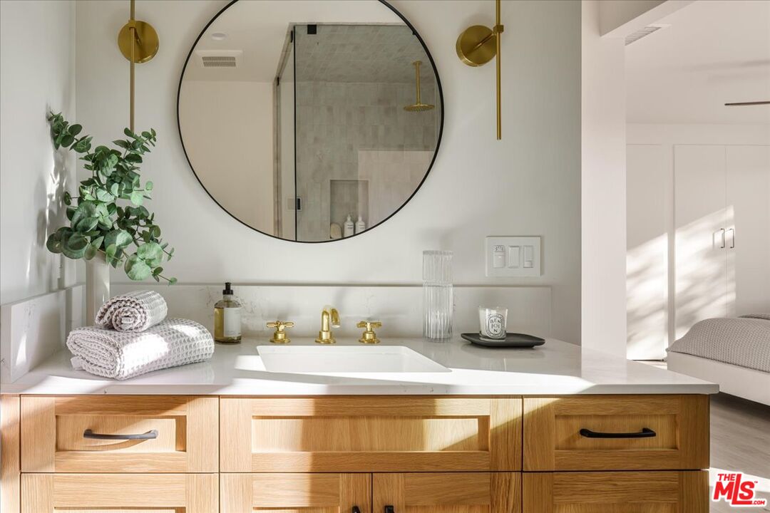 4119 Aralia Road Altadena, CA 91001 - Photo 19 of 37 a bathroom with a sink and mirror