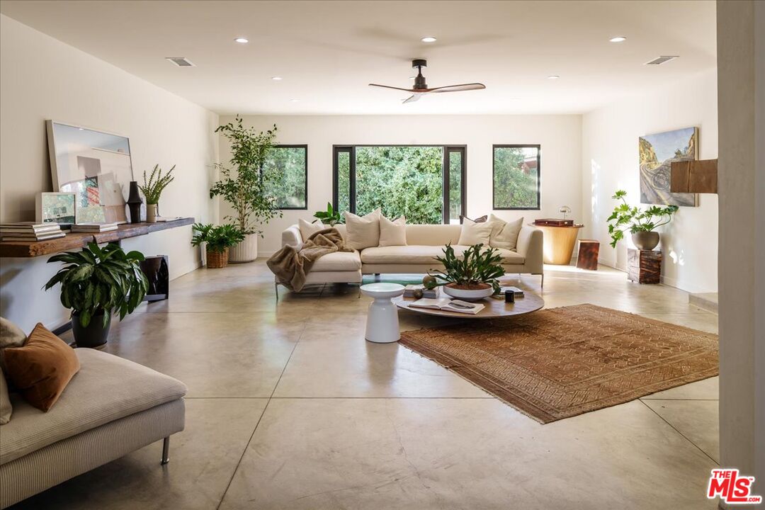 4119 Aralia Road Altadena, CA 91001 - Photo 2 of 37 a living room with furniture and a large window