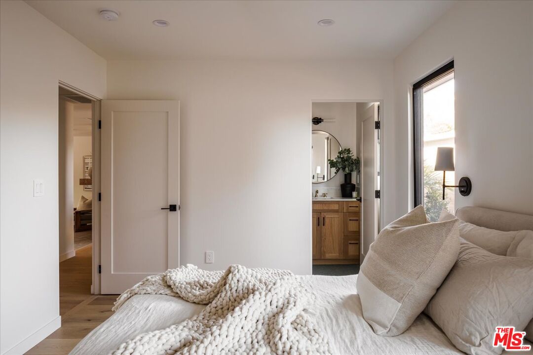 4119 Aralia Road Altadena, CA 91001 - Photo 23 of 37 a bedroom with a bed and a couch