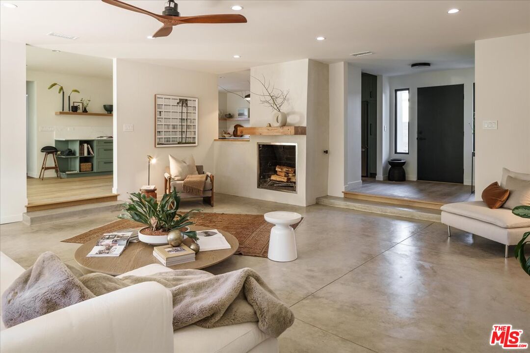 4119 Aralia Road Altadena, CA 91001 - Photo 3 of 37 a living room with furniture and a fireplace
