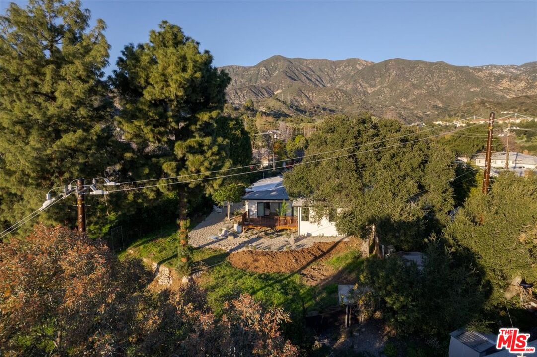 4119 Aralia Road Altadena, CA 91001 - Photo 31 of 37 a view of a lake with mountains in the background