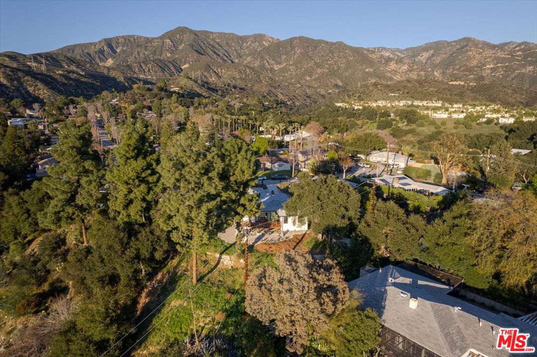 4119 Aralia Road Altadena, CA 91001 - Photo 32 of 37 a view of a house with a mountain and a forest