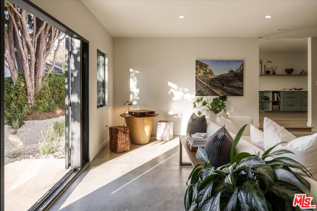 4119 Aralia Road Altadena, CA 91001 - Photo 4 of 37 a living room with furniture and a potted plant