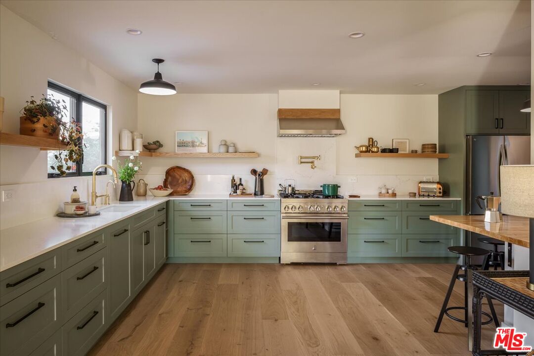 4119 Aralia Road Altadena, CA 91001 - Photo 7 of 37 a kitchen with a sink cabinets and wooden floor