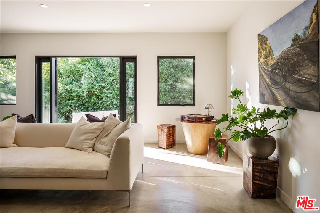 4119 Aralia Road Altadena, CA 91001 - Photo 10 of 37 a living room with furniture and a potted plant