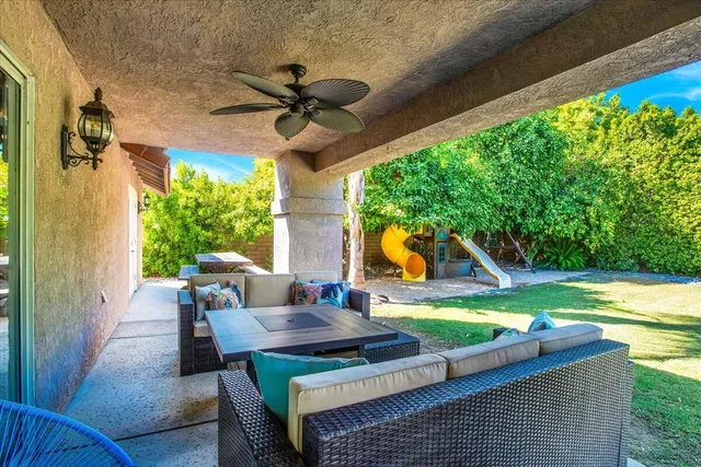 a view of a swimming pool with a patio