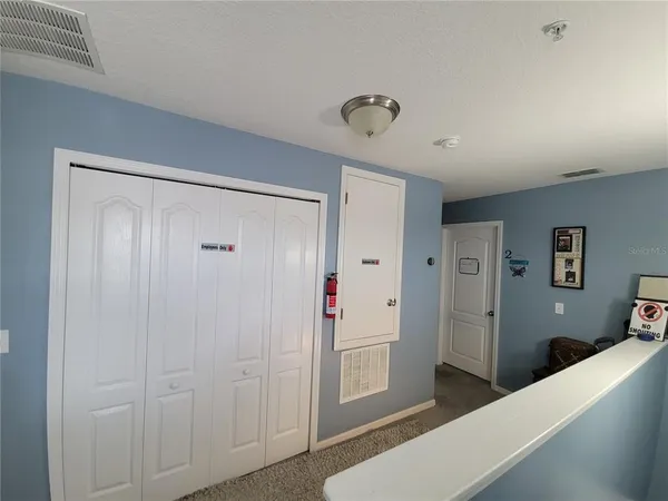 a view of a hallway with bathroom