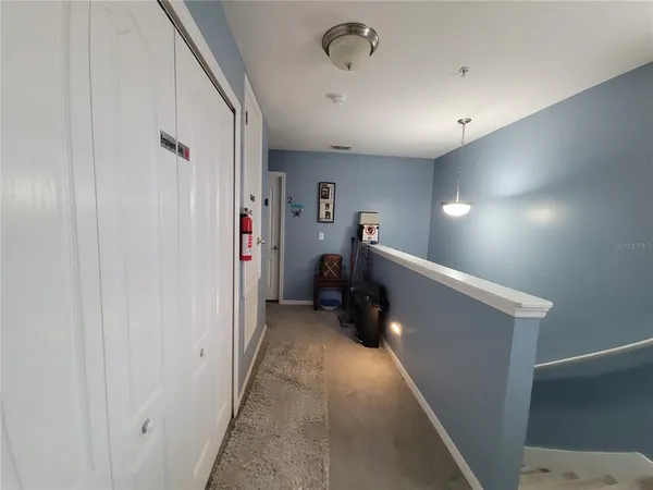 a view of a hallway with workspace