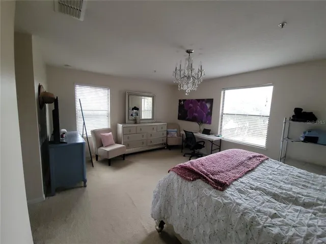 a bed room with a bed furniture and a window