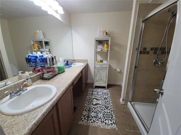 a bathroom with a sink a vanity and a mirror
