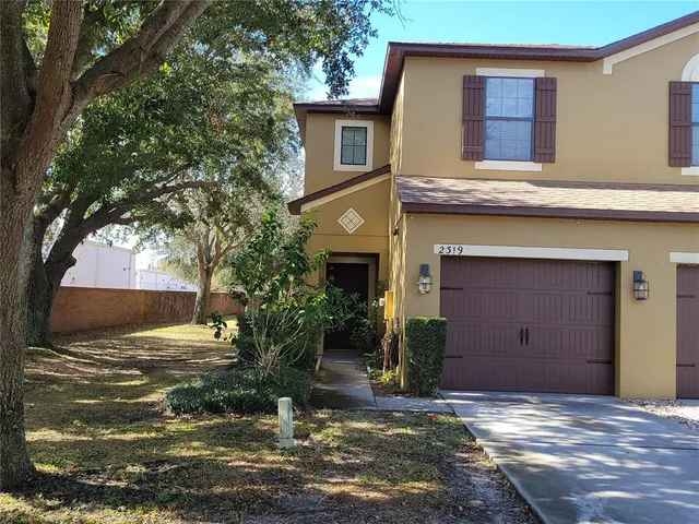 a view of a house with a yard
