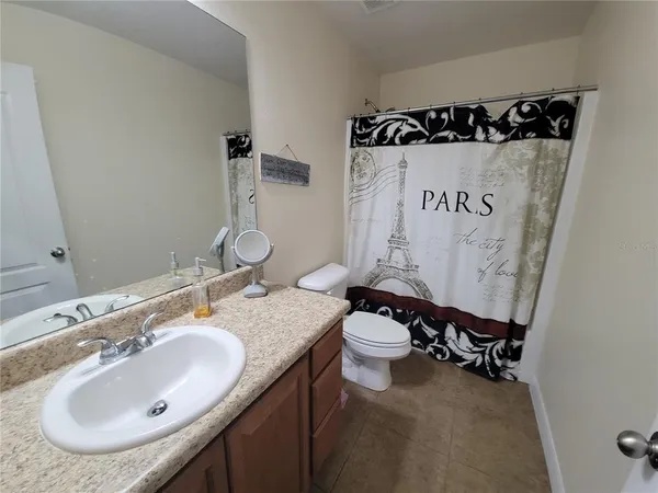 a bathroom with a sink and mirror
