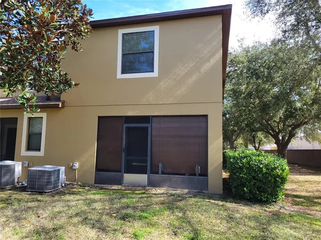 a view of a backyard of the house