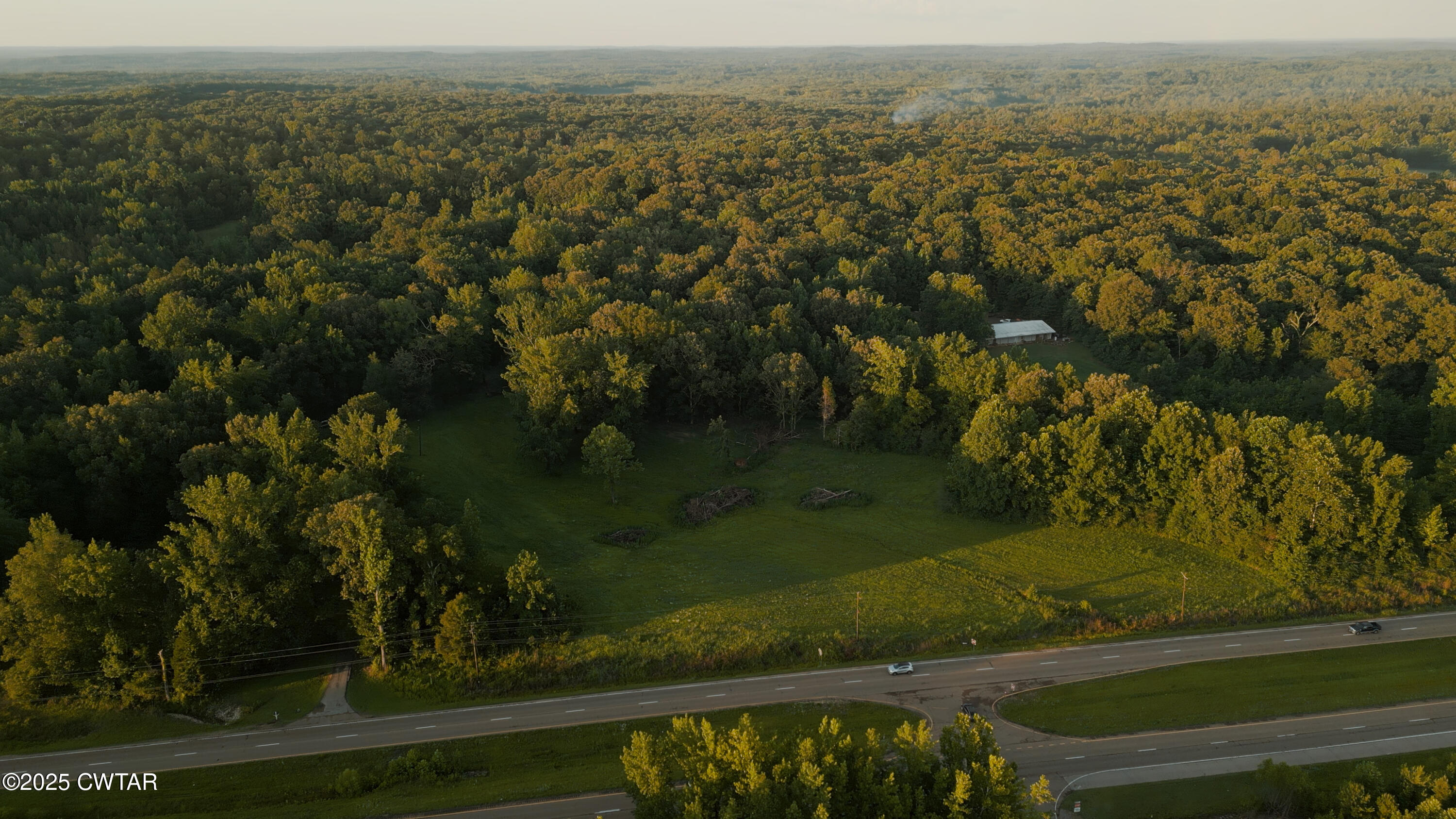 0 Us-45 Street Jackson, TN 38301 - Photo 14 of 17 an aerial view of residential houses with outdoor space and trees