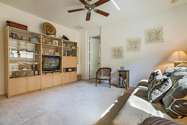 a living room with furniture a couch and a window