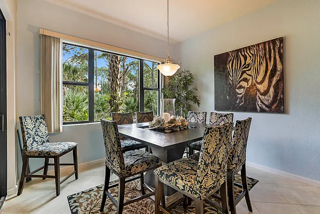 a view of a dining room with furniture window and outside view