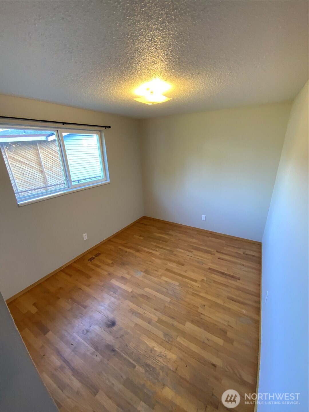 621 Brookdale Road East Tacoma, WA 98445 - Photo 12 of 14 a view of empty room with window