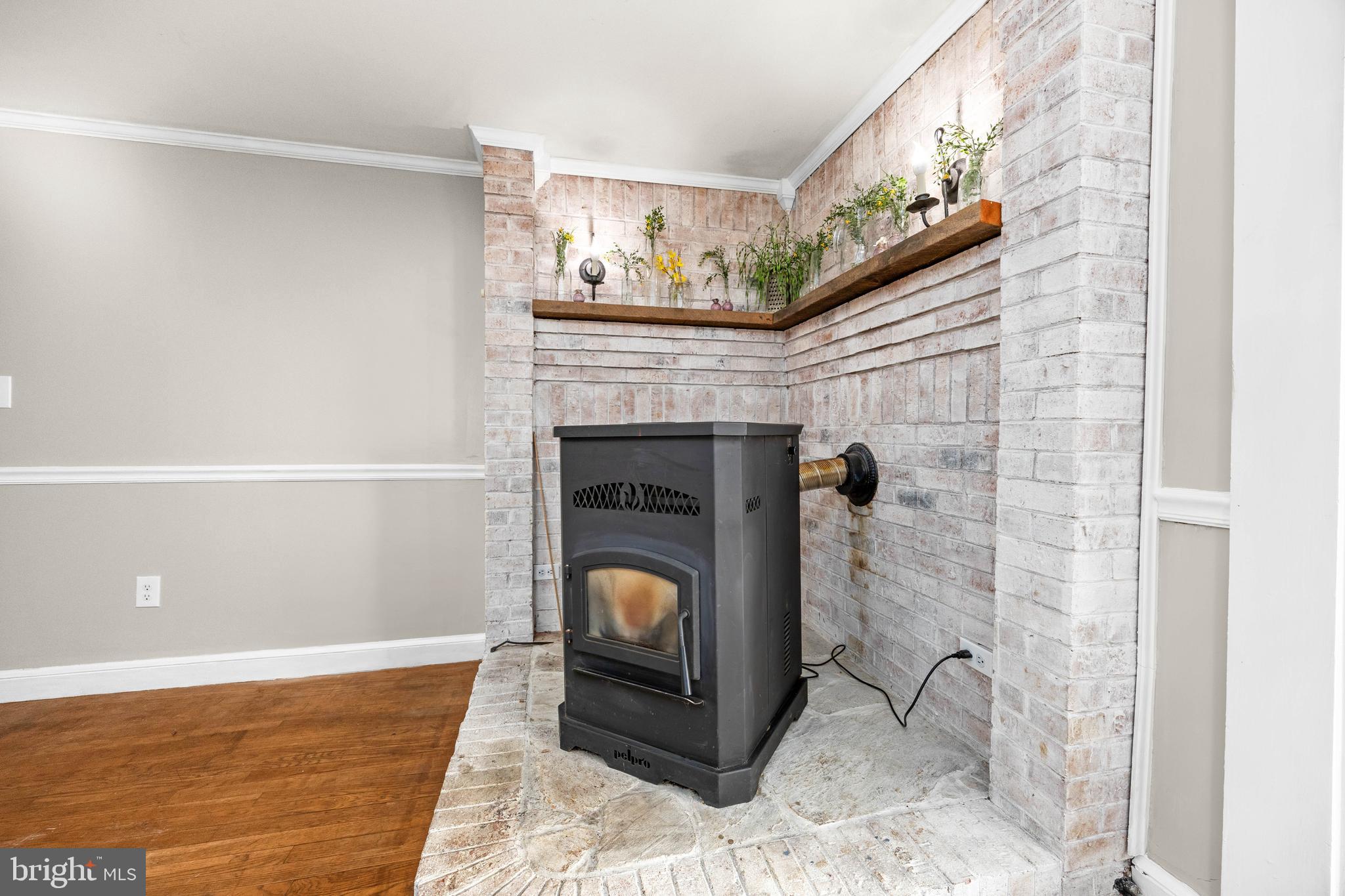 9973 Champ Road Princess Anne, MD 21853 - Photo 8 of 28 a living room with furniture and a fireplace