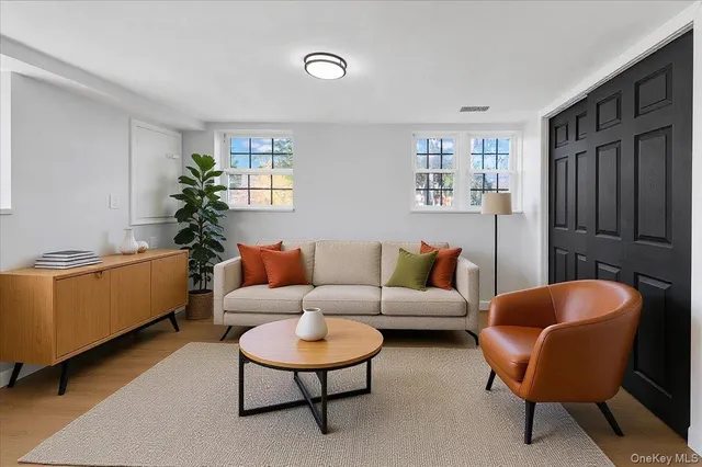 a living room with furniture and a window