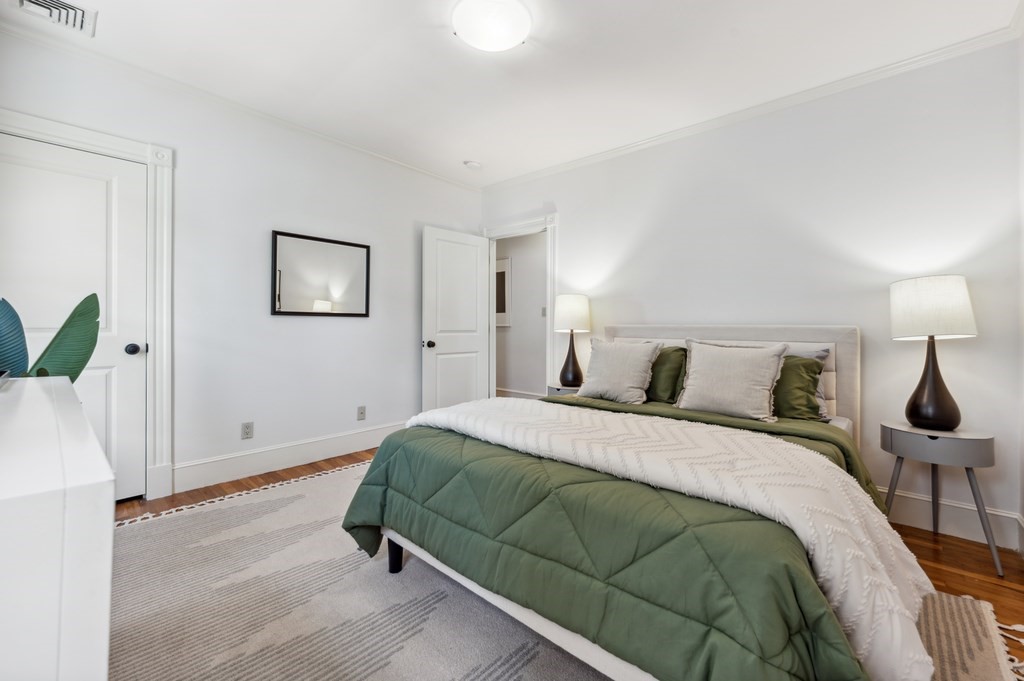 7 Haskell Street, Unit B Cambridge, MA 02140 - Photo 13 of 23 a bedroom with a bed and a lamp