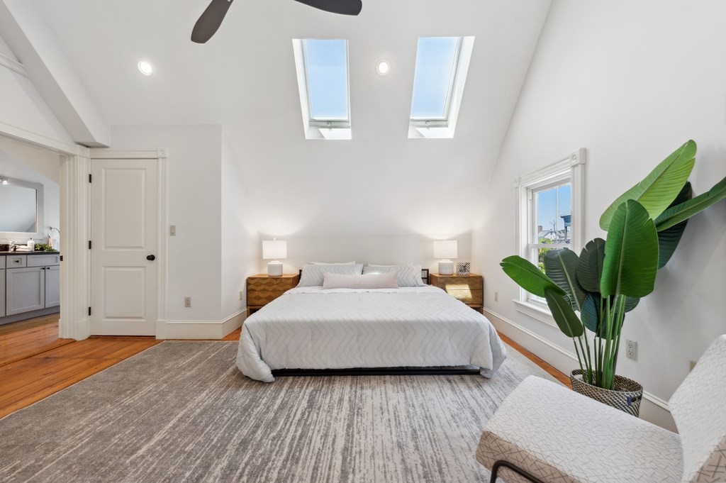 7 Haskell Street, Unit B Cambridge, MA 02140 - Photo 16 of 23 a bedroom with a bed and a potted plant