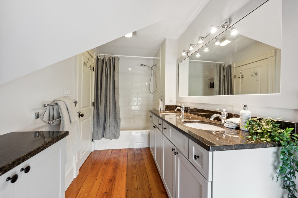 7 Haskell Street, Unit B Cambridge, MA 02140 - Photo 20 of 23 a spacious bathroom with a sink and a large mirror