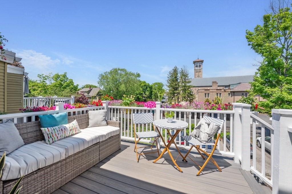 7 Haskell Street, Unit B Cambridge, MA 02140 - Photo 21 of 23 a balcony with wooden floor and outdoor seating