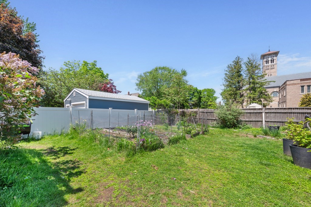 7 Haskell Street, Unit B Cambridge, MA 02140 - Photo 22 of 23 a backyard of a house with lots of green space