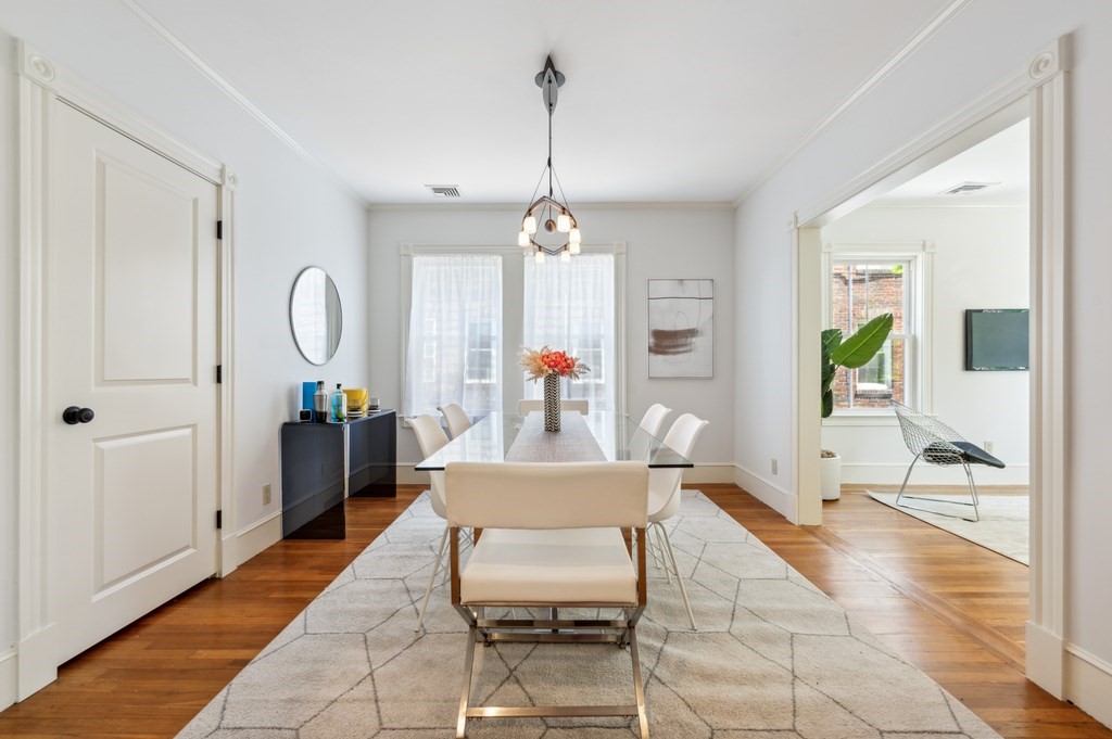 7 Haskell Street, Unit B Cambridge, MA 02140 - Photo 6 of 23 a living room with furniture a window and a chandelier