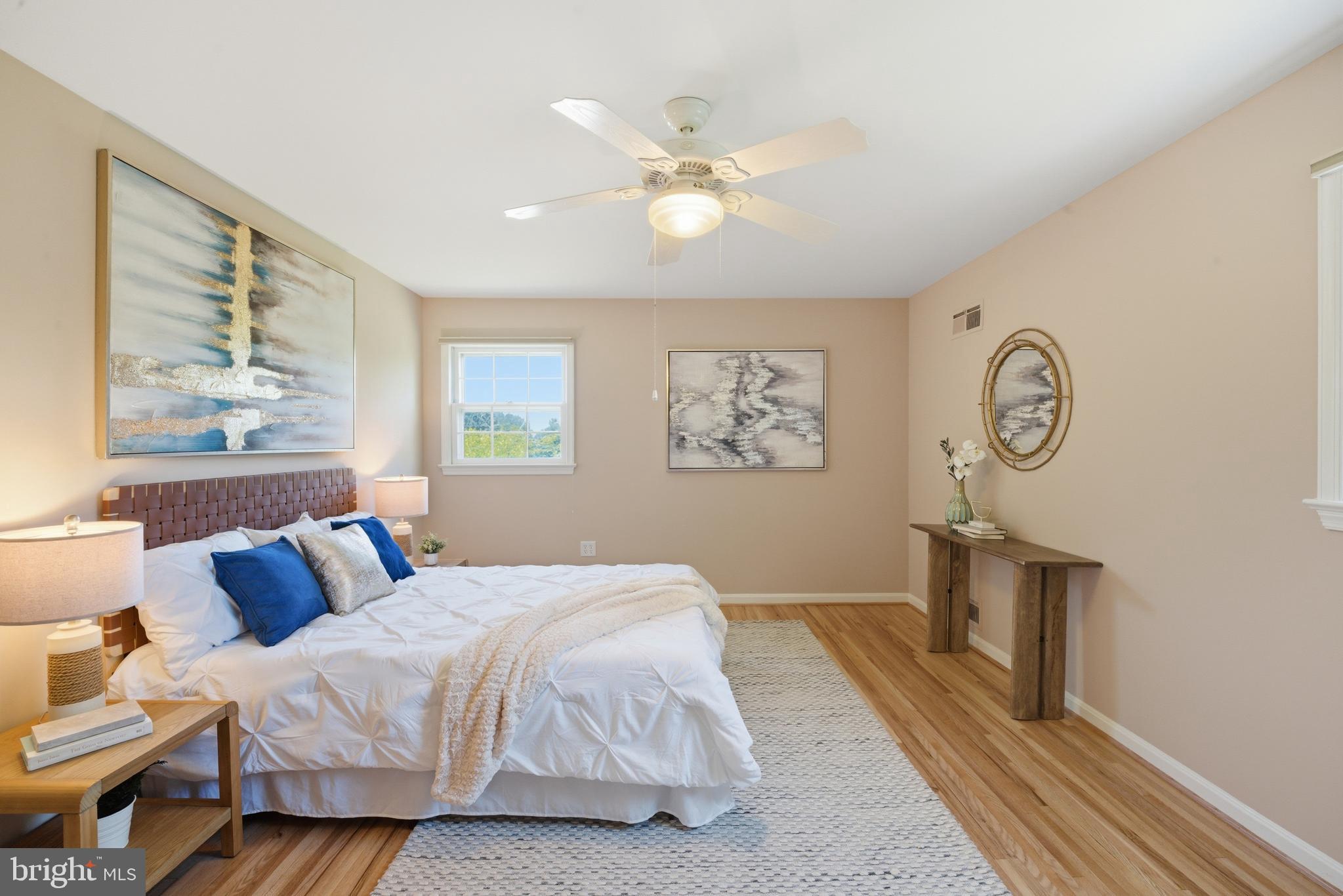 13309 Old Forge Road Silver Spring, MD 20904 - Photo 26 of 52 a bedroom with bed and a chandelier