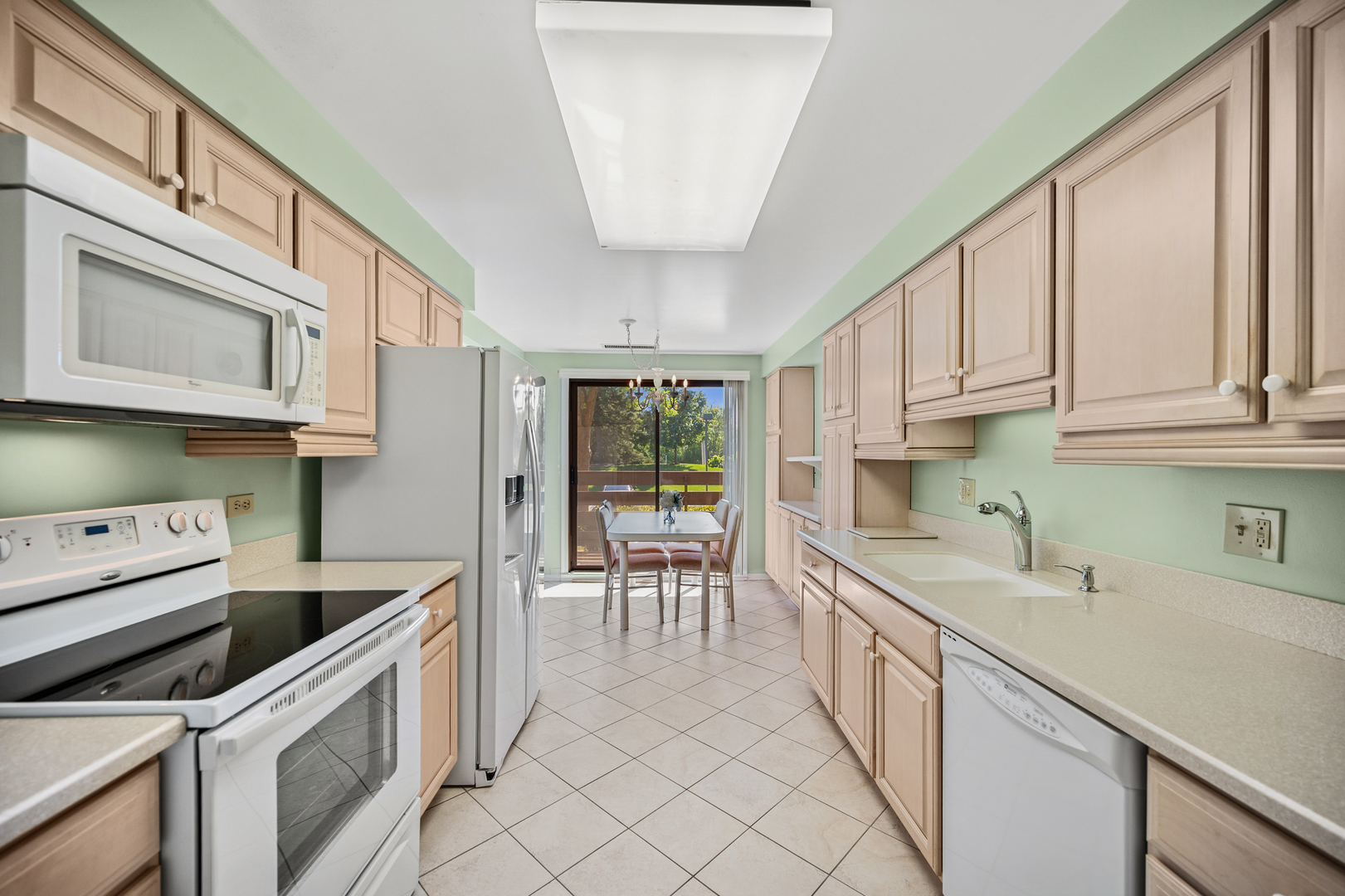2000 Chestnut Avenue, Unit 103 Glenview, IL 60025 - Photo 11 of 27 a kitchen with a sink and cabinets