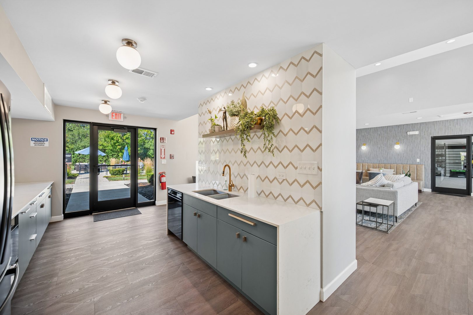 2000 Chestnut Avenue, Unit 103 Glenview, IL 60025 - Photo 26 of 27 a spacious bathroom with a double vanity sink a large mirror and a shower