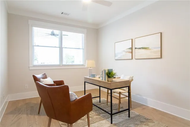 a view of a hallway with entryway wooden floor and front door