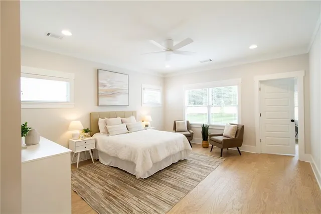 a spacious bathroom with a shower sink and mirror