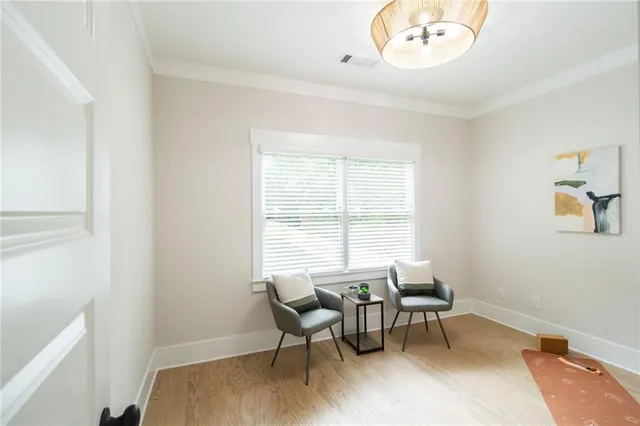 a white bath tub sitting next to a white sink