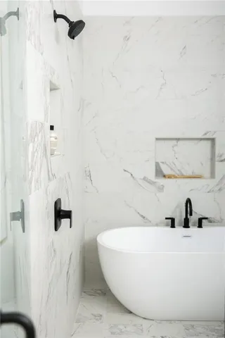 a bathroom with a double vanity sink and a mirror