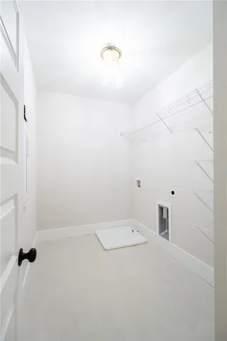 a view of a house with backyard and a trees