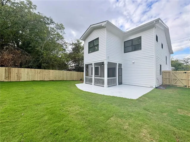 a view of roof deck with chairs and wooden floor