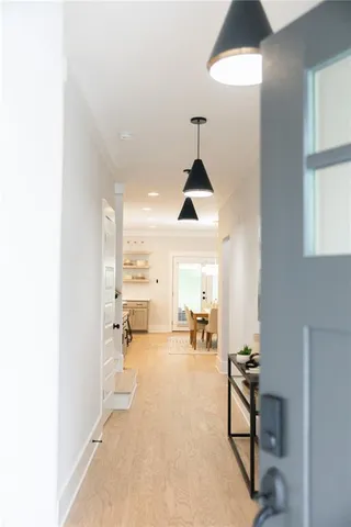 a kitchen with a sink a counter space appliances and cabinets