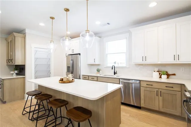 a view of a a dining room with furniture window and wooden floor