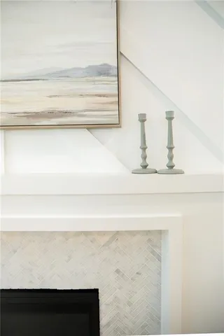 a kitchen with stainless steel appliances granite countertop white cabinets and window