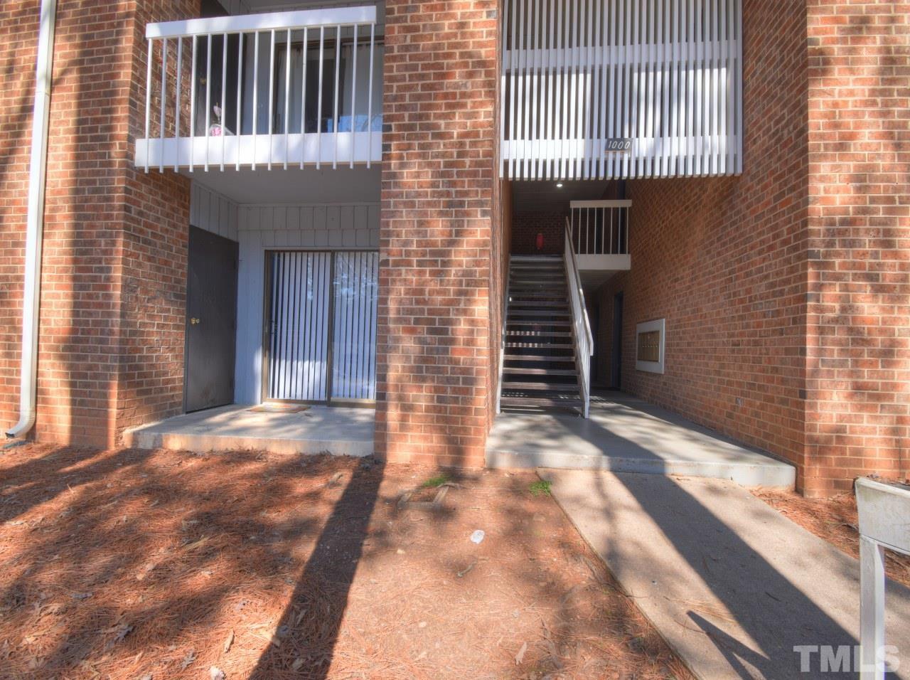 1000 Sandlin Place, Unit A Raleigh, NC 27606 - Photo 15 of 17 a view of a house with backyard and porch