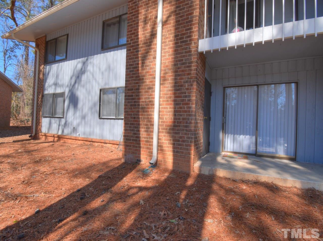 1000 Sandlin Place, Unit A Raleigh, NC 27606 - Photo 16 of 17 a view of a backyard of the house